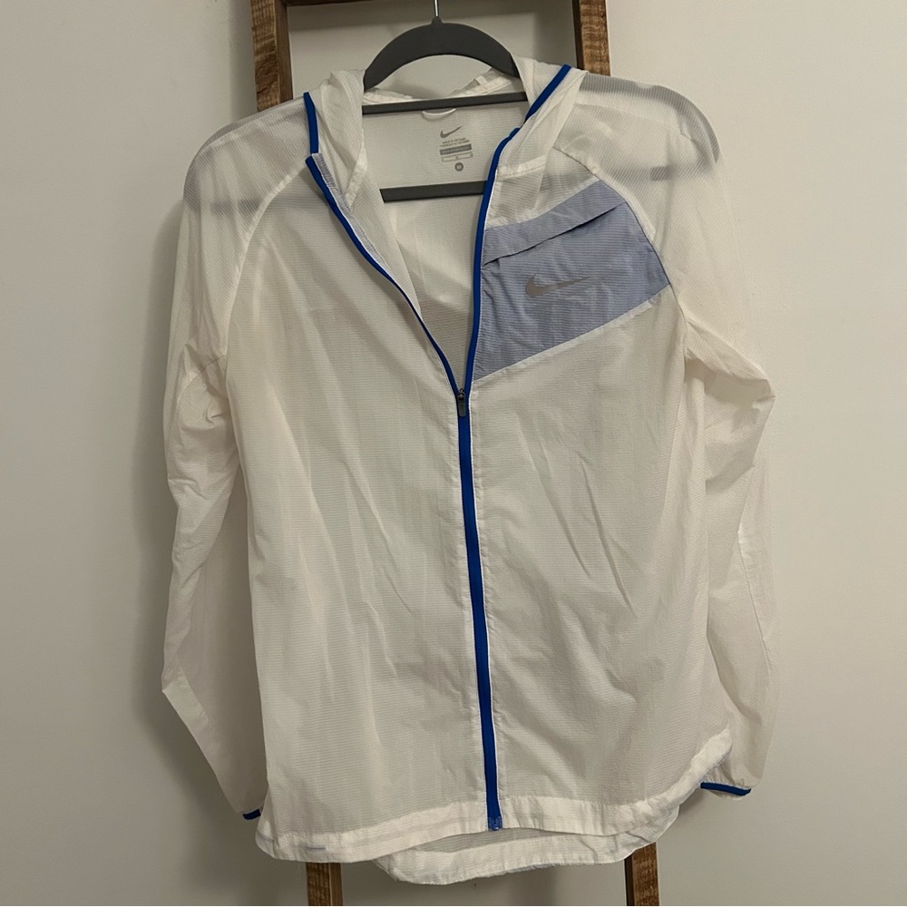 Nike ultra light jacket, women’s size medium, white.